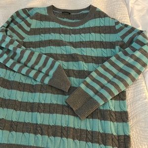 Woman’s striped sweater. Pale blue and gray.